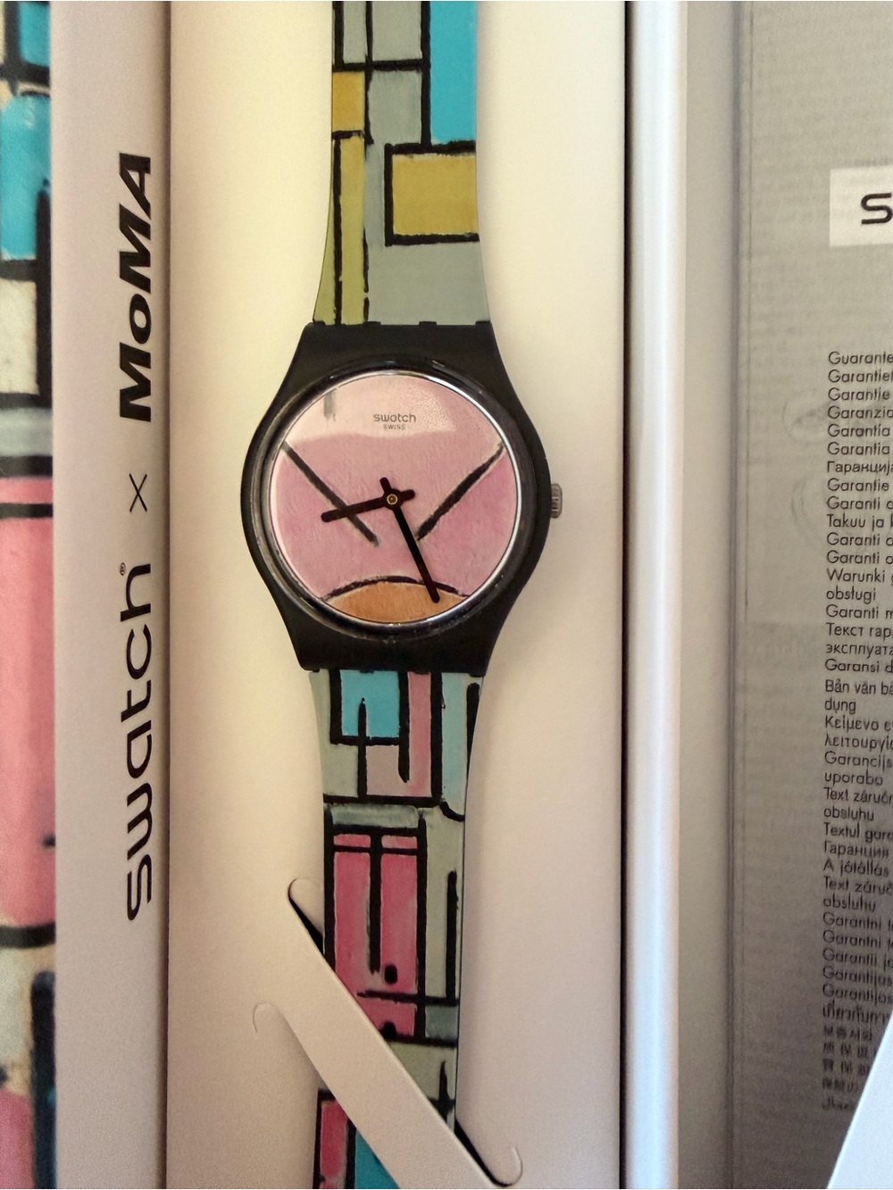 Swatch Black Case Watch with Pink Dial and Multicolor Geometric Strap